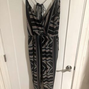 BCBG jumpsuit, in multi colors, and open back.